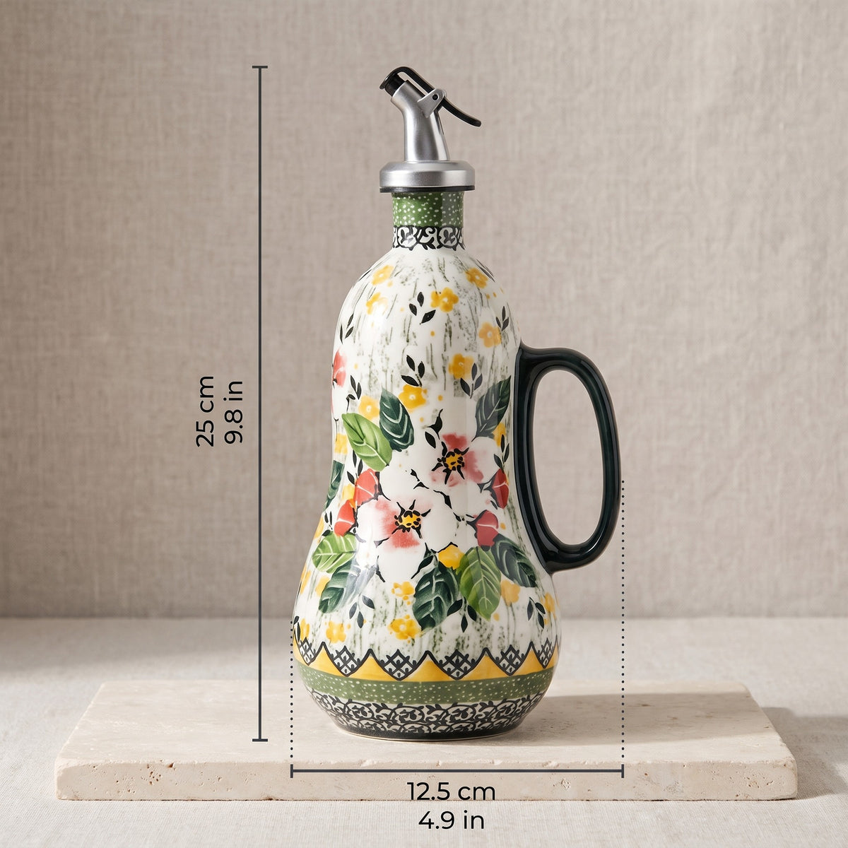 Size: about 25 cm tall including the spout, 12.5 cm wide including the handle