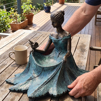 Size reference: the bird bath on a table next to a coffee mug
