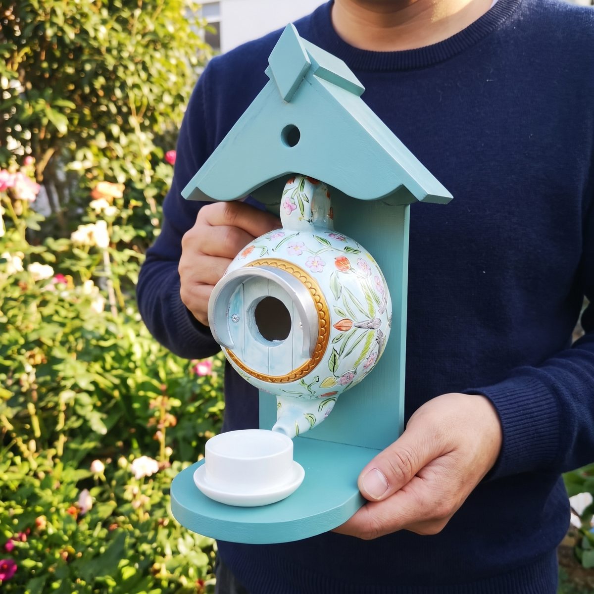 Size: the teapot nest box held in two hands