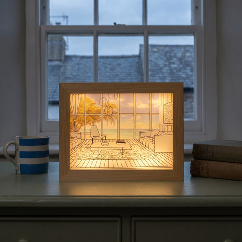 Ambrose's Light Painting, Seaside Room, glowing on a sideboard in the evening