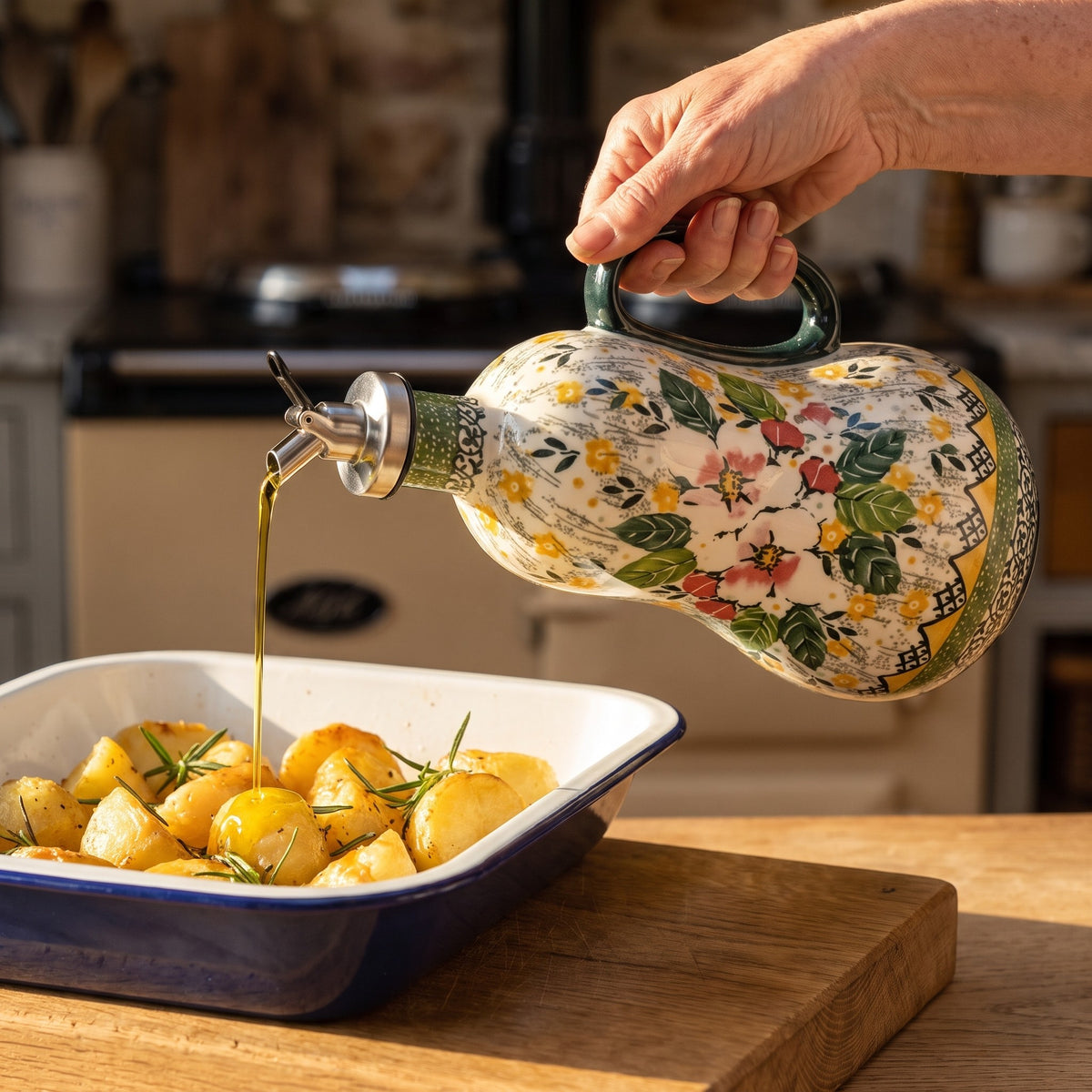 Pouring olive oil over roast potatoes from the Dog Rose dispenser