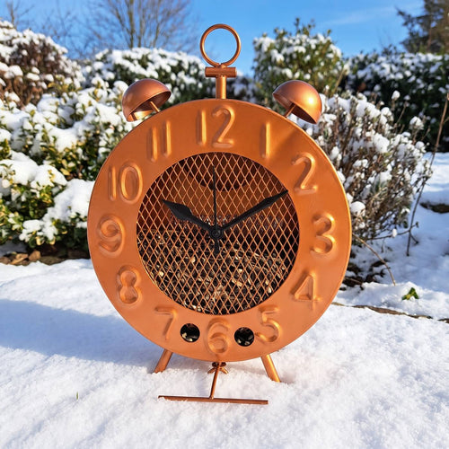 Melanie's copper clock bird feeder standing in the snow