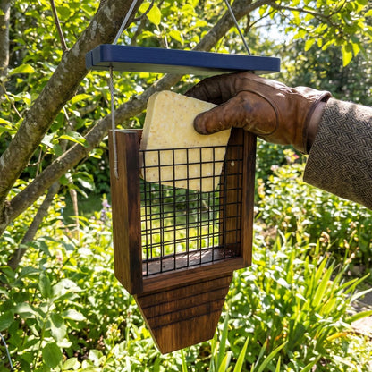 Lift the roof and drop in a suet block