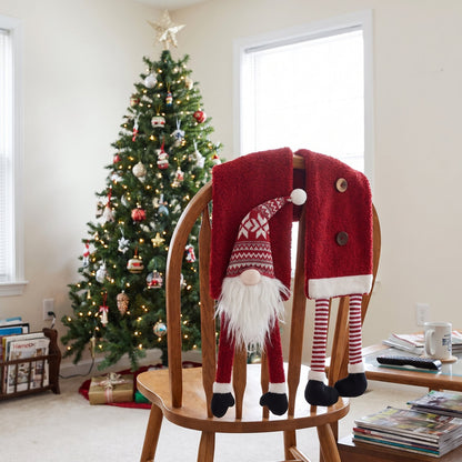 Gnome Christmas scarf draped over a chair by the tree