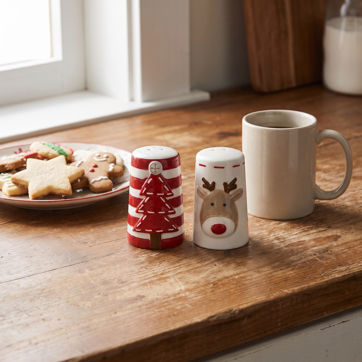 The salt and pepper pair on a kitchen counter next to a coffee mug