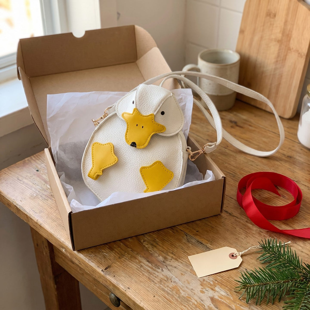 The duck bag in a gift box with tissue paper