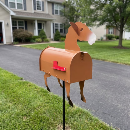 Tan horse mailbox on a ground stake at a driveway
