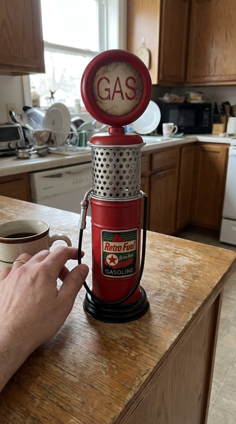 Gas pump coin bank on a kitchen counter