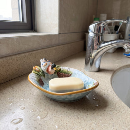 Mallard dish holding a bar of soap by the tap