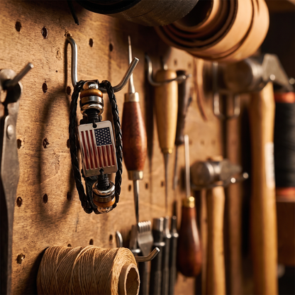 American flag bracelet hanging on a workshop pegboard