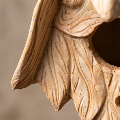 Close-up of the carved wood grain and leaf beard