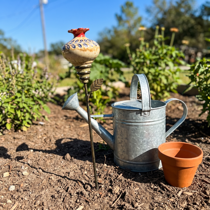 Size comparison: about two feet tall next to a watering can
