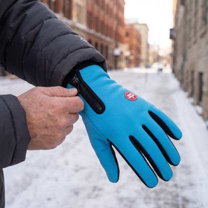 Closing the Storm Cuff zip on a Sky Blue glove over a parka