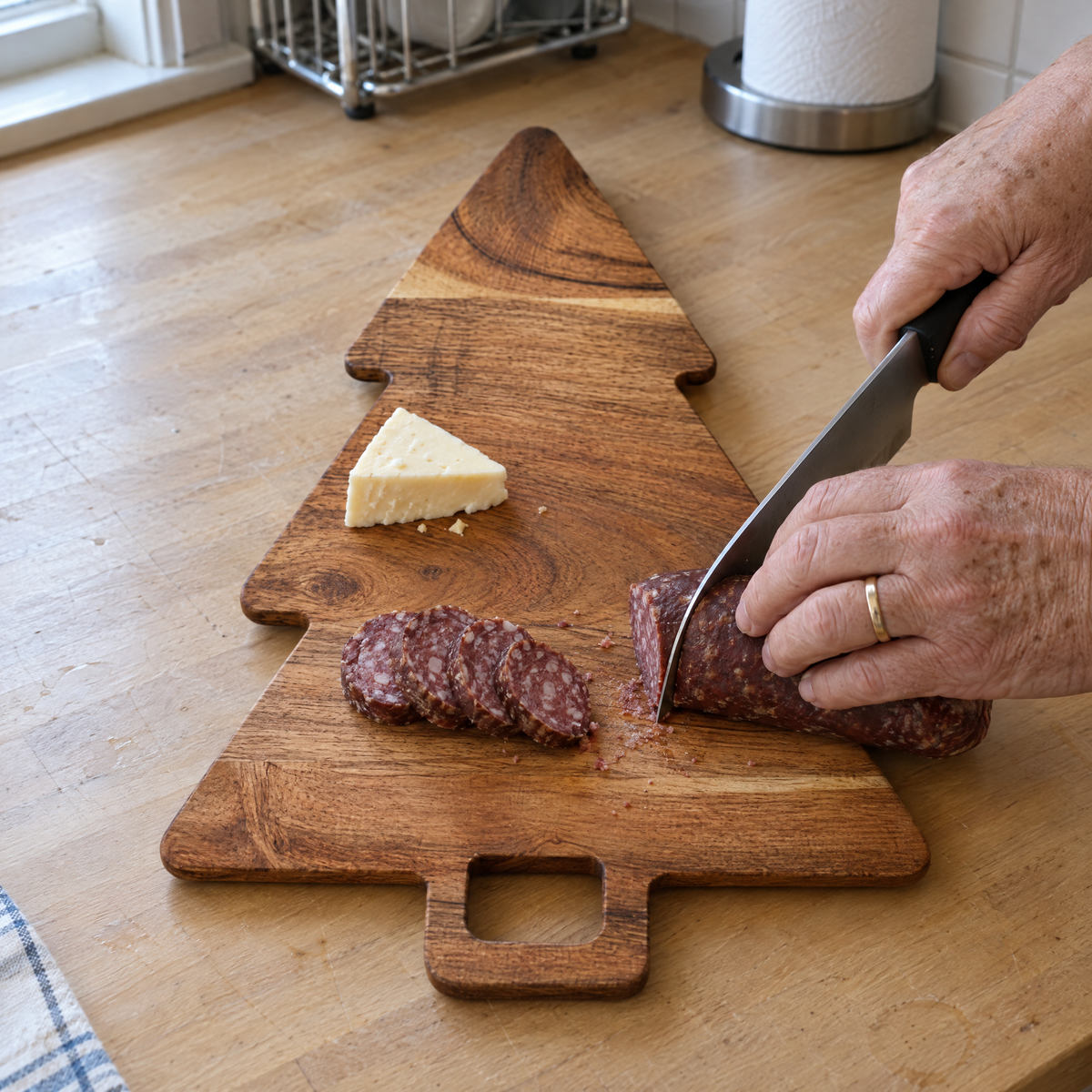 Slicing summer sausage on the acacia tree board