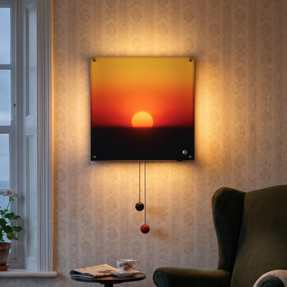 Ewart's sunset wall light hanging beside a bed, the sun glowing above the horizon