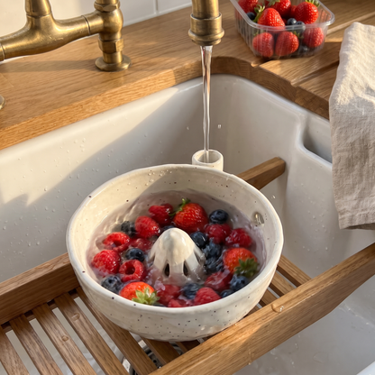 Shingle Cream berry bowl rinsing berries under the tap