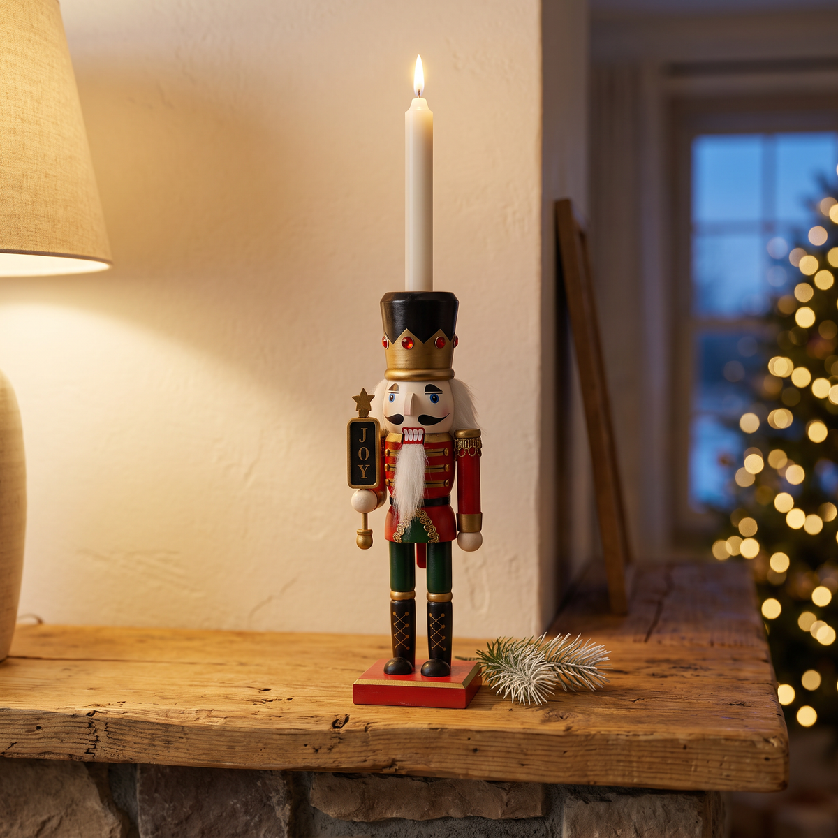 Norbert's painted nutcracker soldier candle holder with a lit taper on a farmhouse mantel