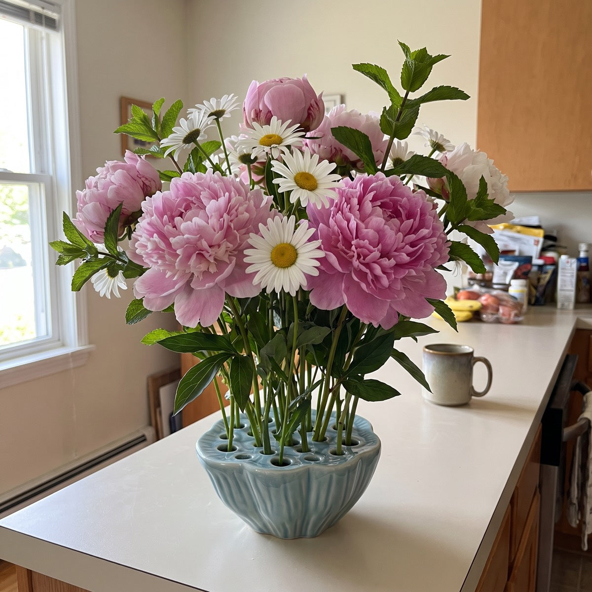 Neva's lotus pod vase in Backwater Blue with a single flower
