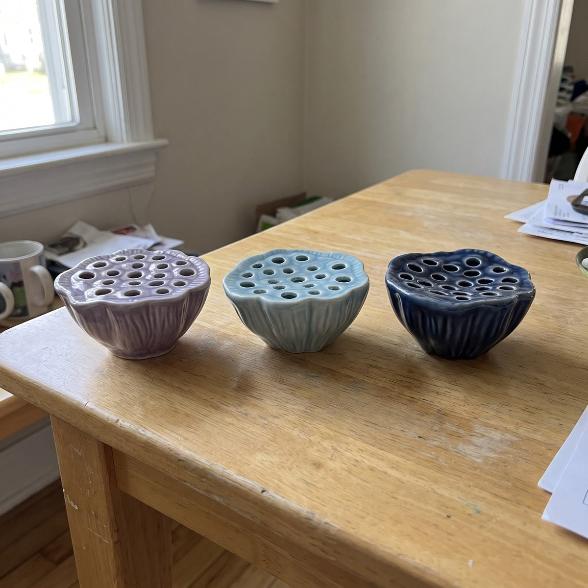 All three lotus pod vase colors side by side
