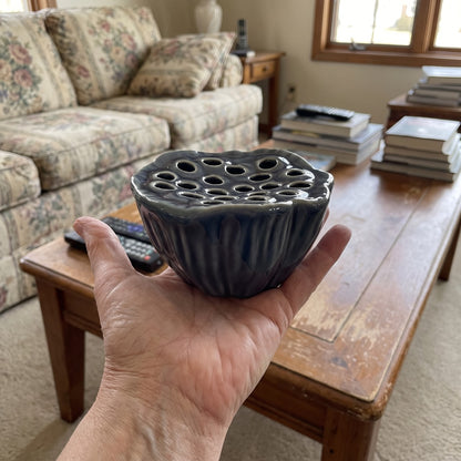 River Dusk lotus pod vase on an open hand for size