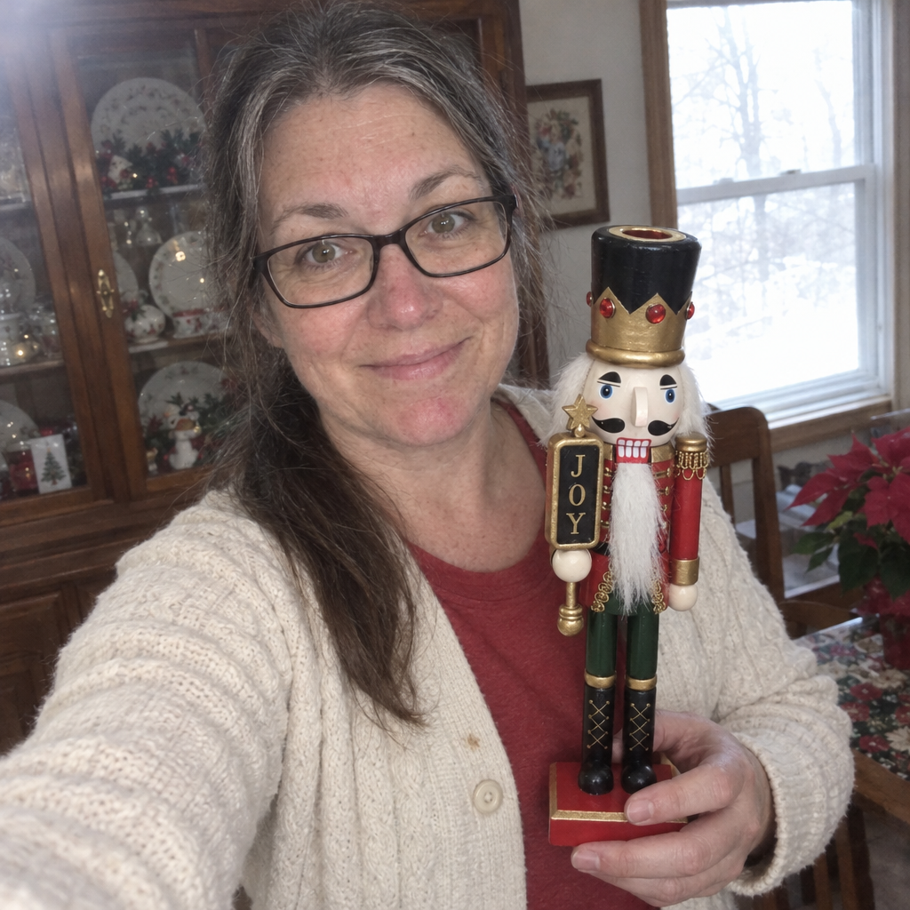Collector holding the painted nutcracker in her dining room