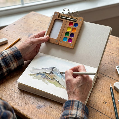 Painting a mountain ridge with the pocket watercolor kit