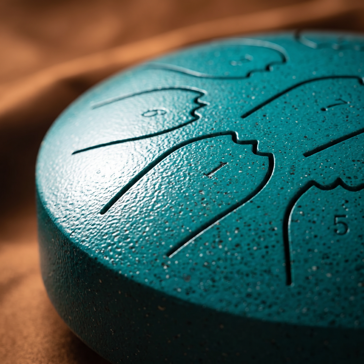 Nell's hand-tuned rain drum, teal pearl finish, side close-up