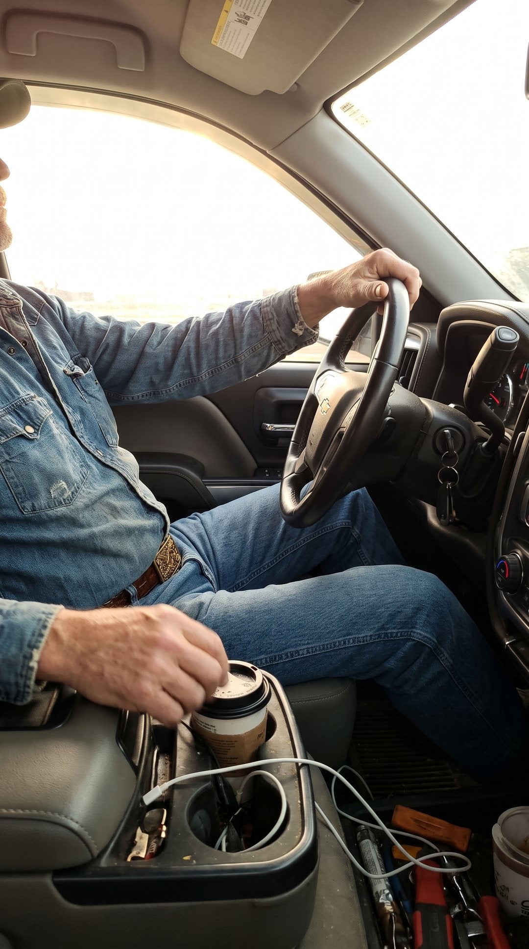 Customer photo: the belt worn behind the wheel of a pickup