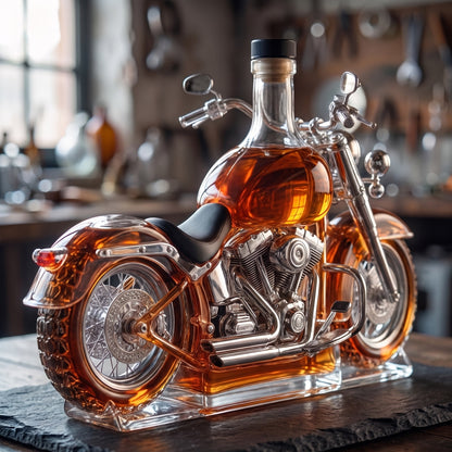 Hand-blown glass motorcycle decanter seen from the rear three-quarter angle, showing seat, rear fender and spoked wheel