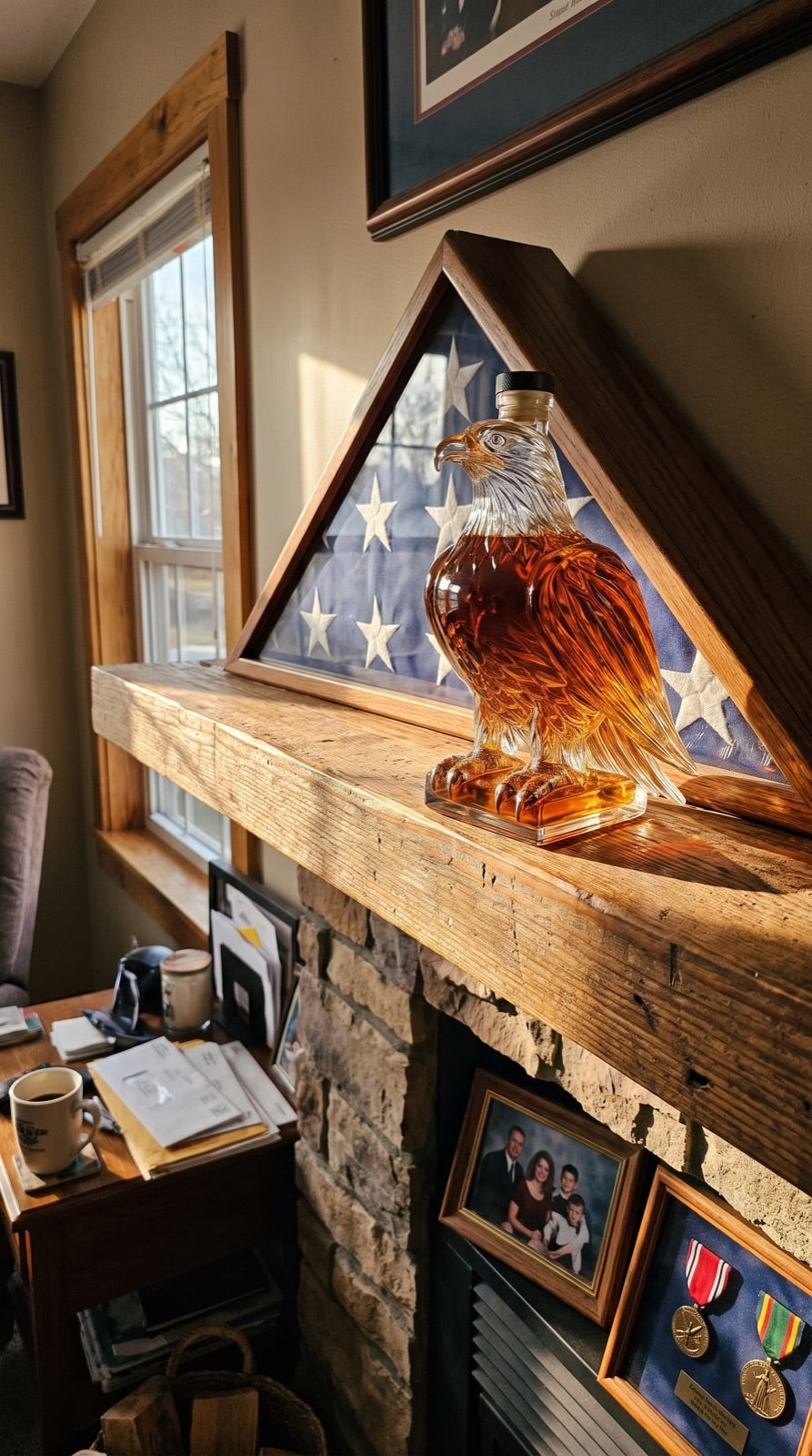 Eagle decanter on a mantel beside a folded flag case